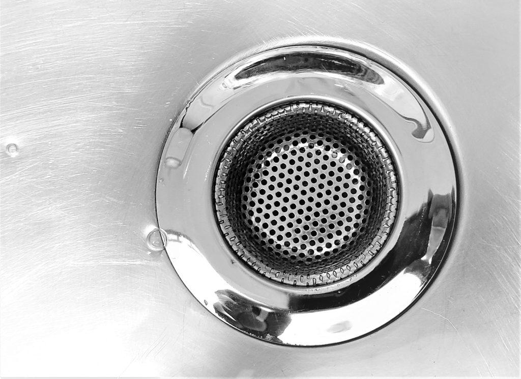why your shower drain smells bad, clogged shower drain